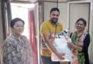 Daniel presenting a gift to the children's home